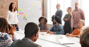 Fueled by Launch professionals in meeting talking about online course